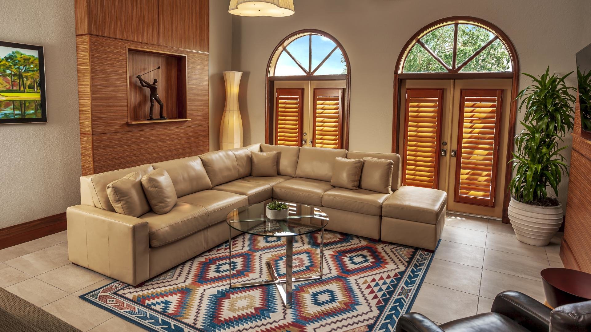 evermore villa living room with brown leather sectional